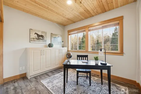 a workspace with furniture and window