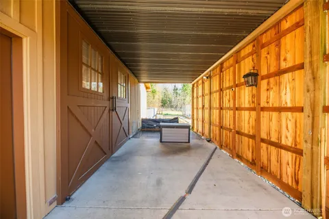 a view of a house with a yard and deck