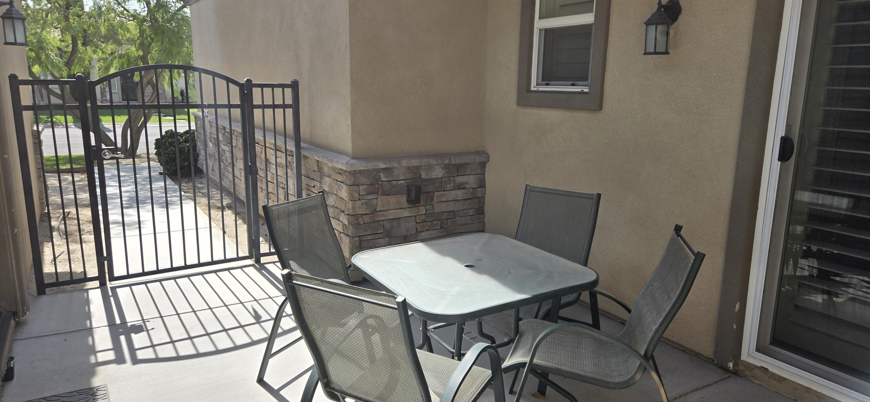 49818 Minelli Street Indio, CA 92201 - Photo 8 of 11 a view of a balcony dining area
