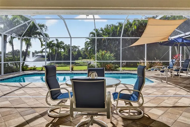 a view of a swimming pool with a patio