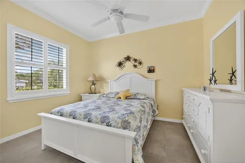 a bedroom with bed and window