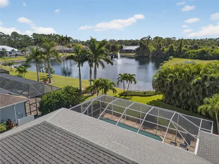 a view of a house with backyard and garden