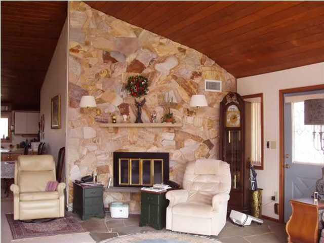 514 Rainbow Ridge Road Faber, VA 22938 - Photo 5 of 8 a living room with furniture and a fireplace