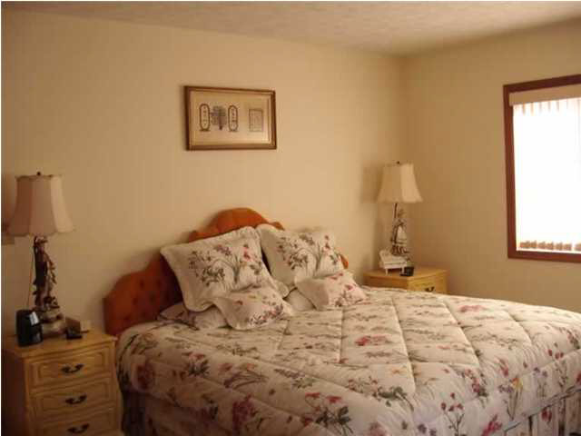 514 Rainbow Ridge Road Faber, VA 22938 - Photo 8 of 8 a bed sitting in a bedroom next to a window