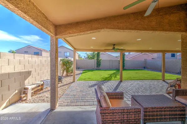a view of a chairs and table in the patio