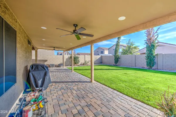 a view of a patio with table and chairs potted plants with wooden floor