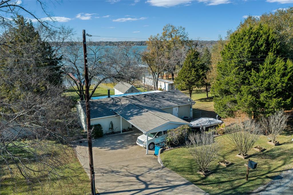 a view of a patio with table and chairs with wooden fence