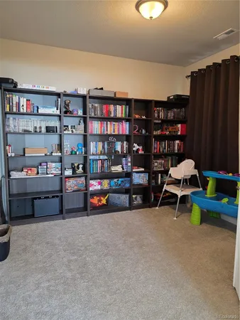 a view of a room with toys and racks