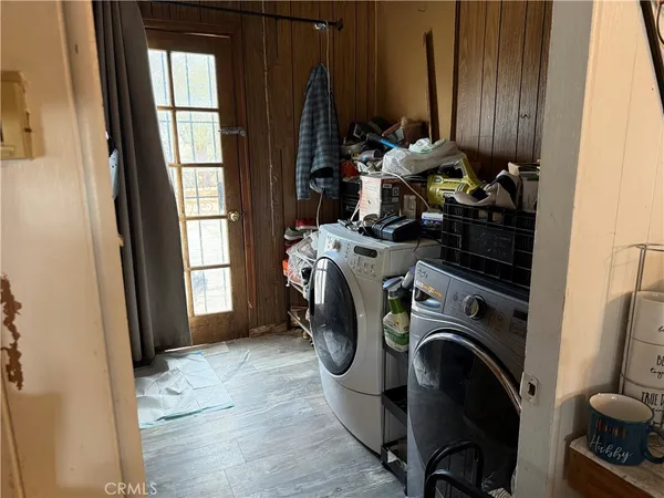 a view of storage and utility room with washer and dryer