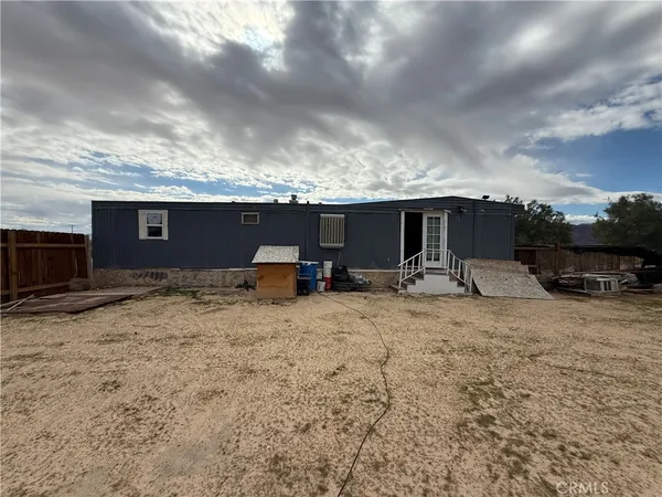 a view of a backyard of the house
