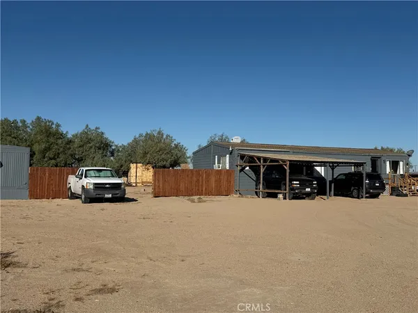 a view of a house with a yard and garage