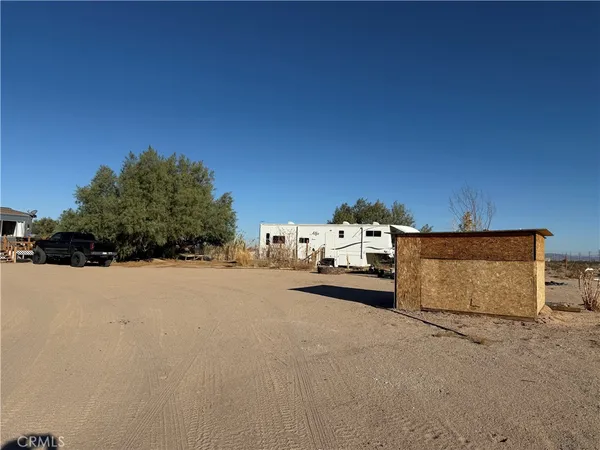 a view of a house with a road