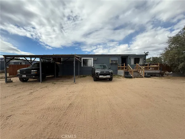 a view of car parked in front of house