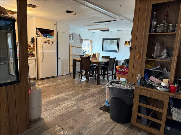 a view of a dining room with furniture and closet