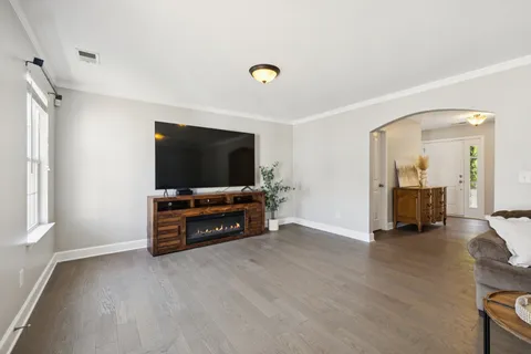 a view of a livingroom with furniture and a flat screen tv