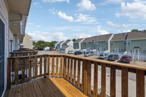 a view of a balcony with sitting area