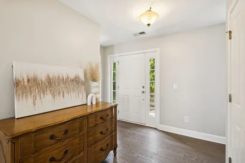 wooden floor with a window in a room