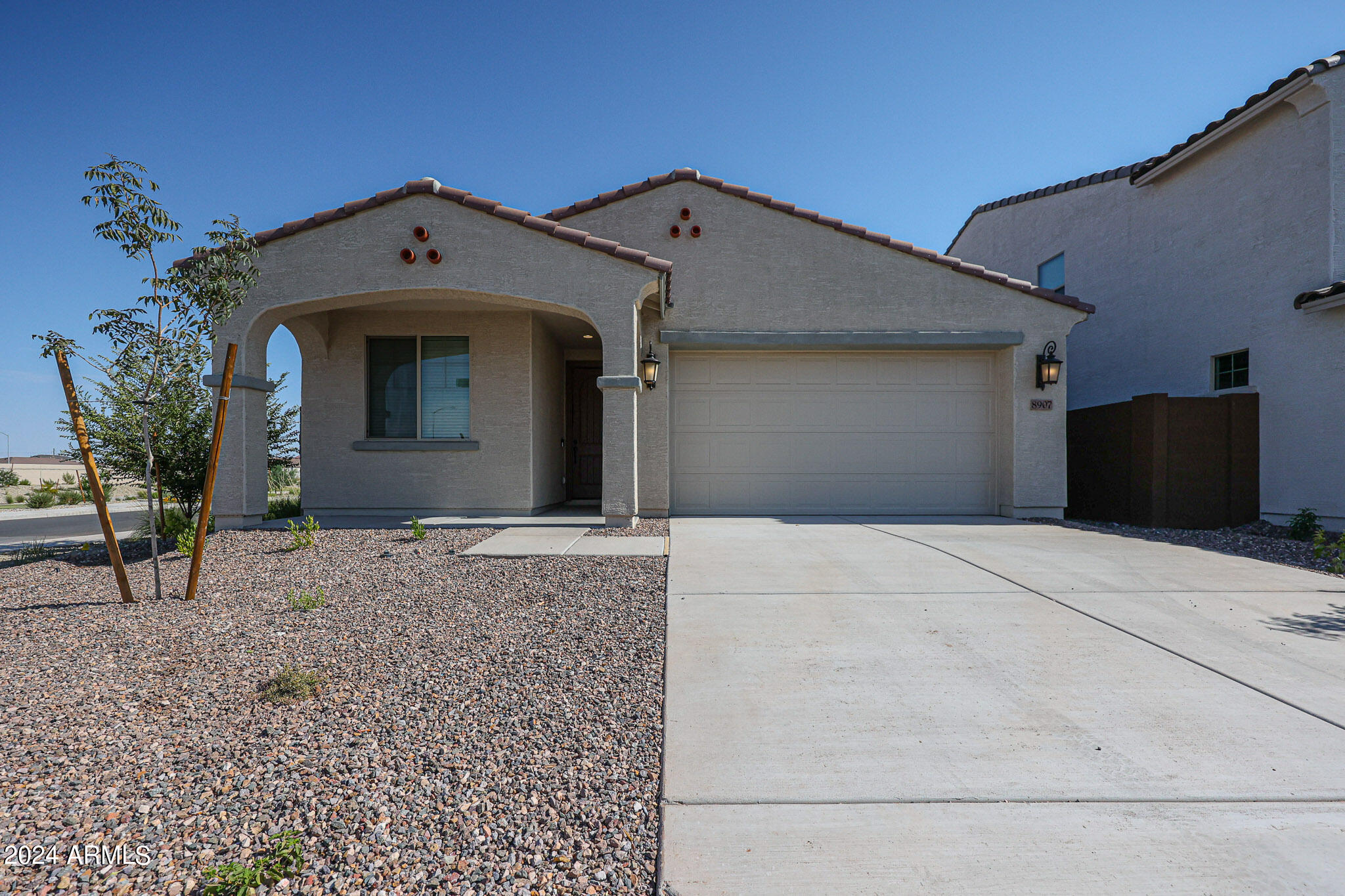 8907 West Colter Street Glendale, AZ 85305 - Photo 1 of 44 a front view of a house with a yard
