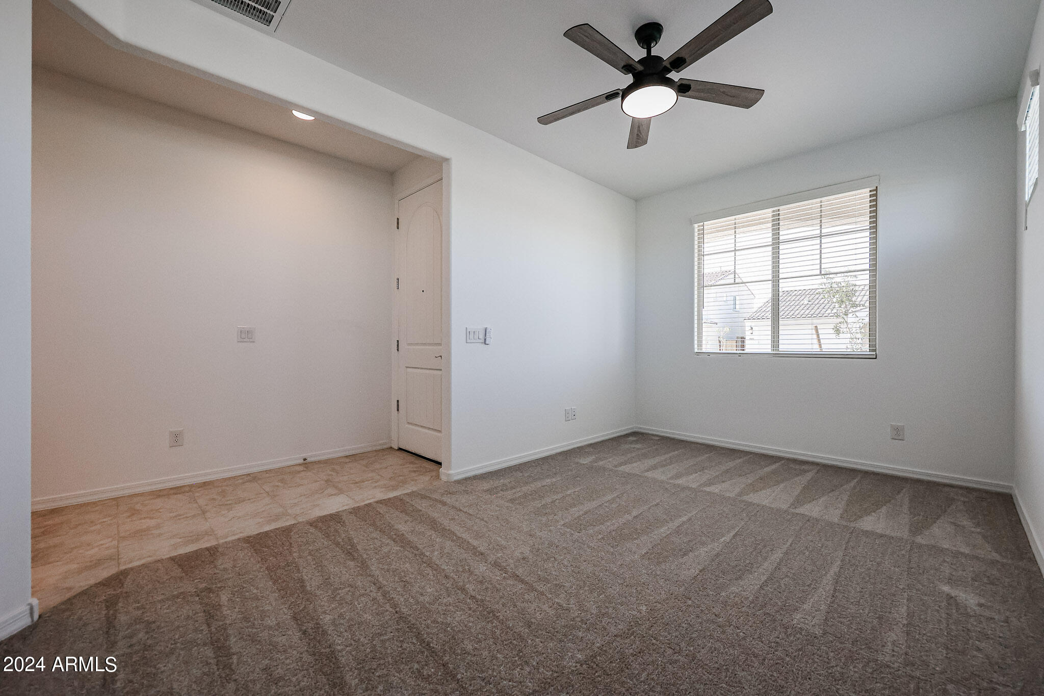8907 West Colter Street Glendale, AZ 85305 - Photo 14 of 44 a view of an empty room with a window