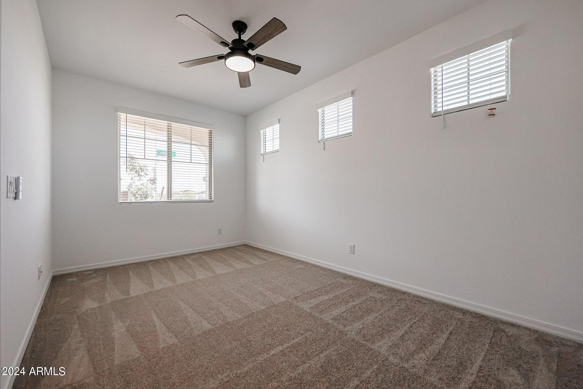8907 West Colter Street Glendale, AZ 85305 - Photo 17 of 44 a view of an empty room with a window