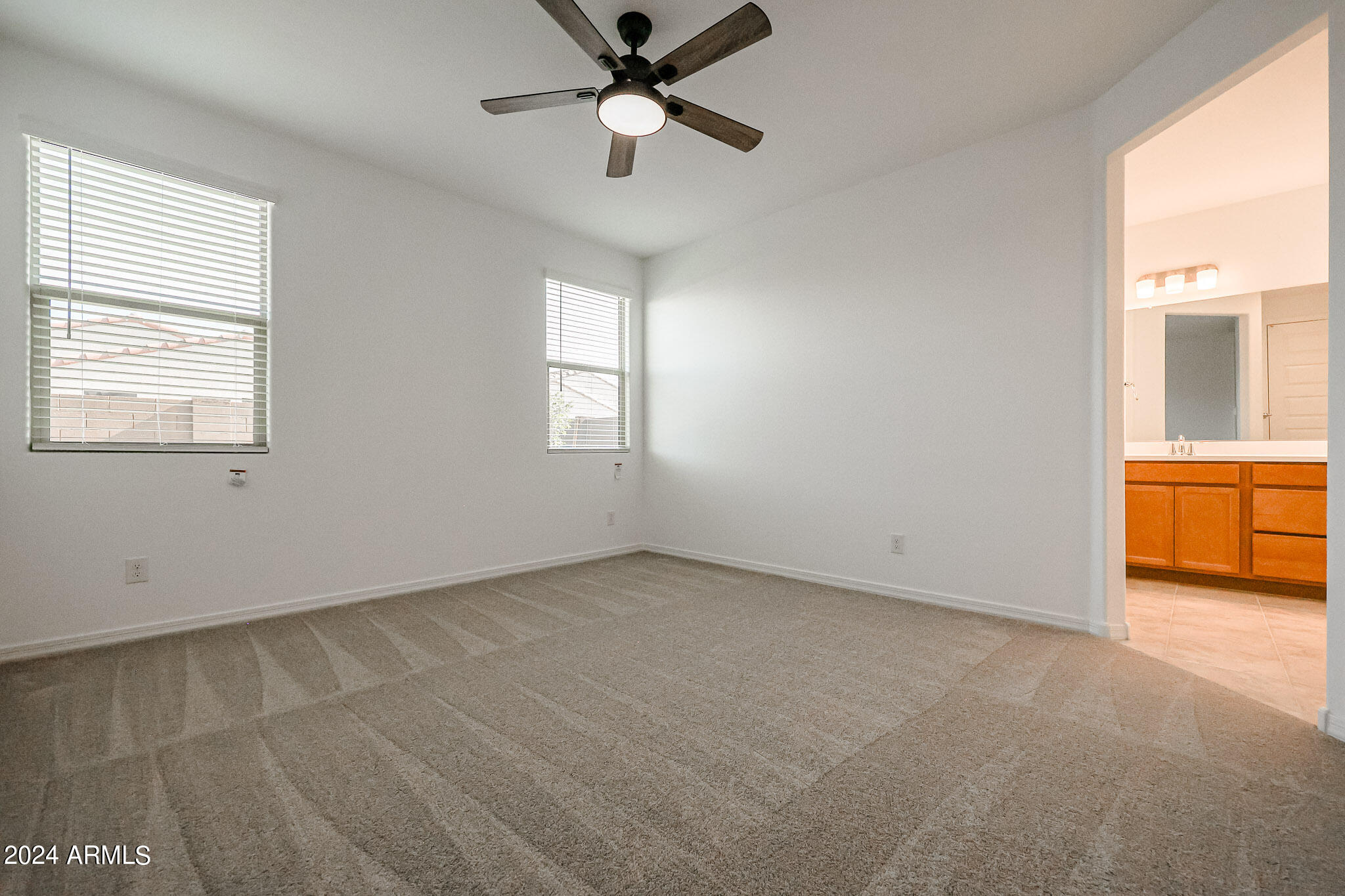 8907 West Colter Street Glendale, AZ 85305 - Photo 19 of 44 a view of an empty room with a window