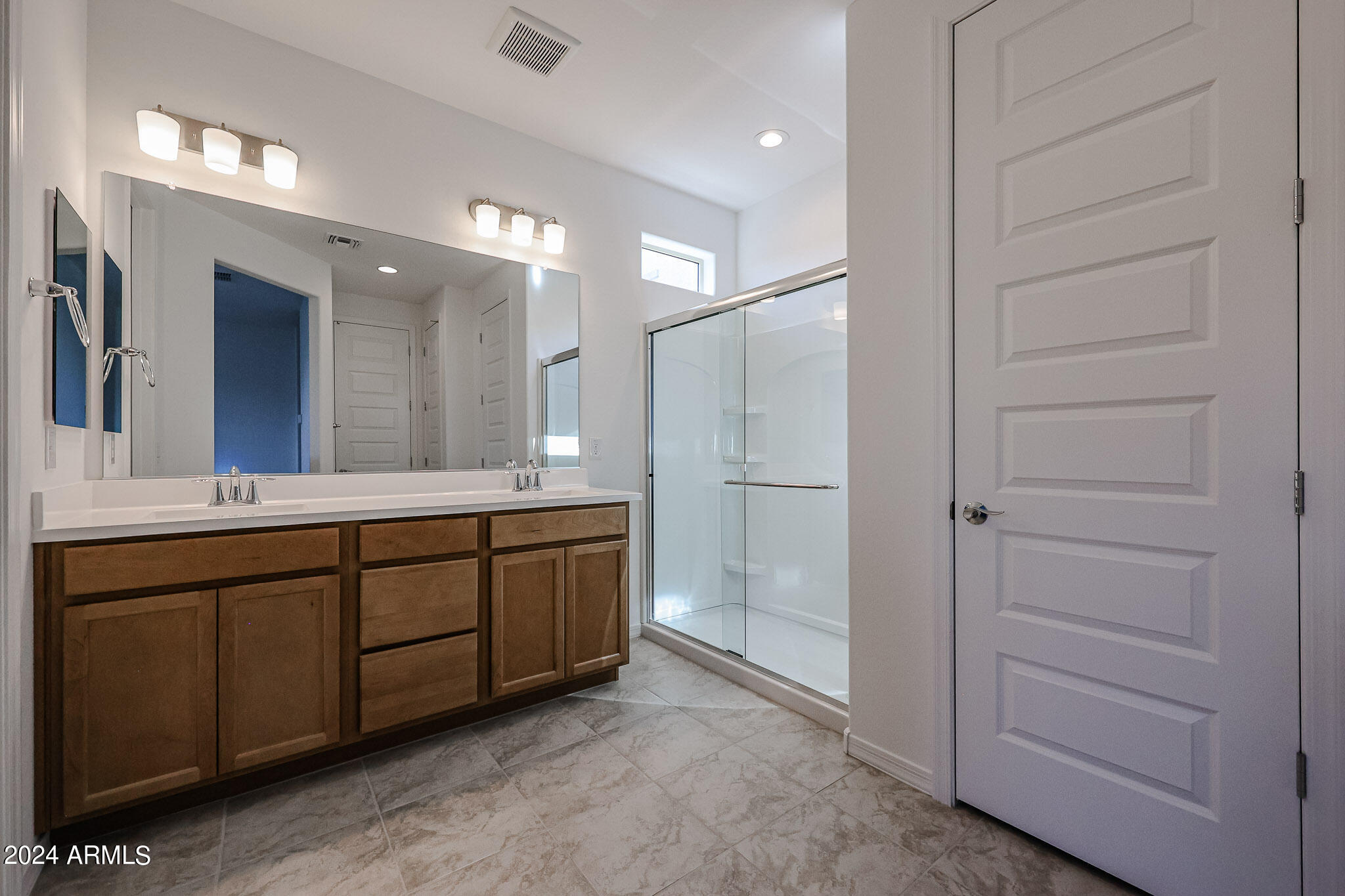 8907 West Colter Street Glendale, AZ 85305 - Photo 23 of 44 a bathroom with a double vanity sink and a mirror