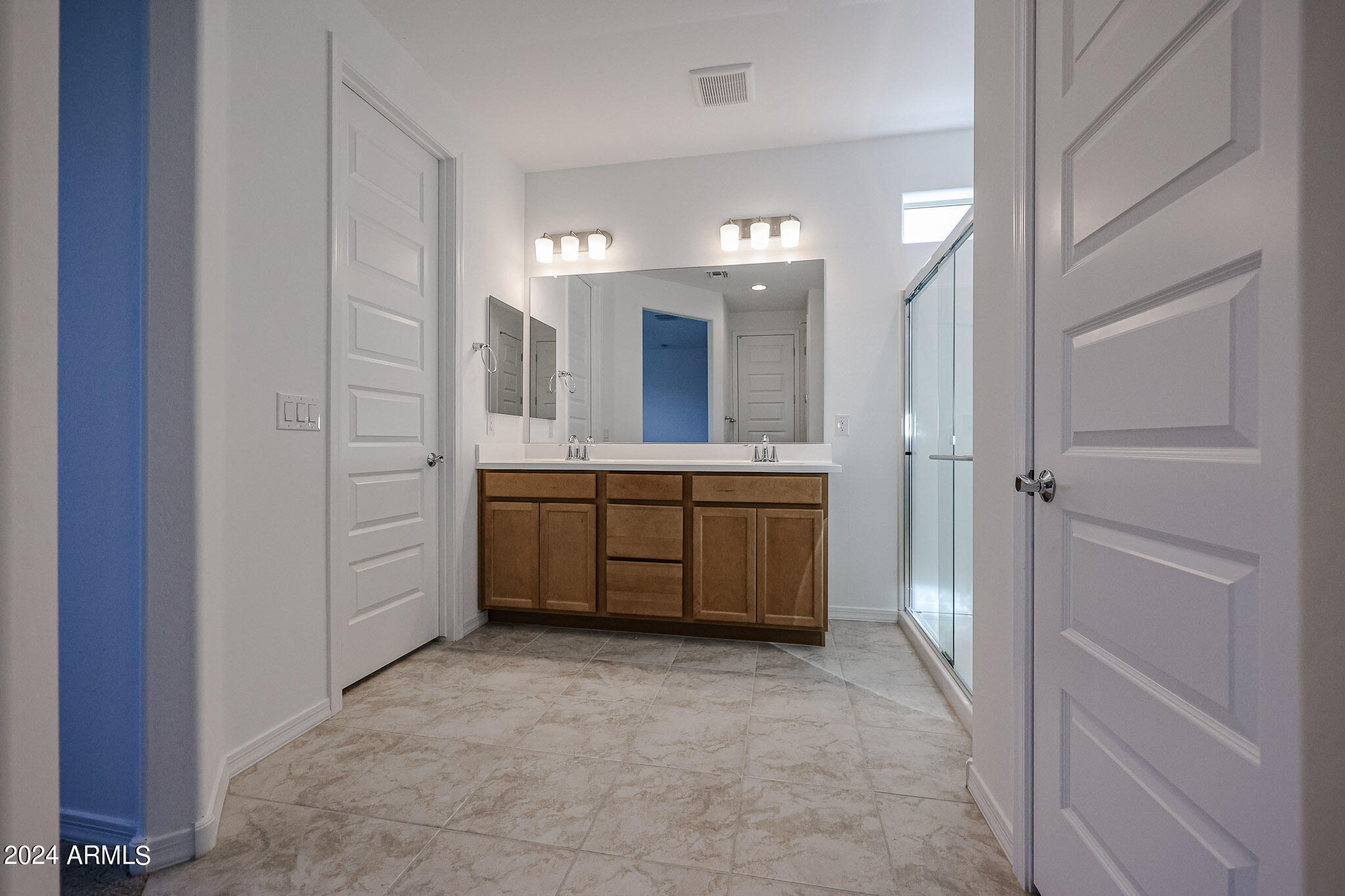 8907 West Colter Street Glendale, AZ 85305 - Photo 24 of 44 a bathroom with a sink a vanity and mirror