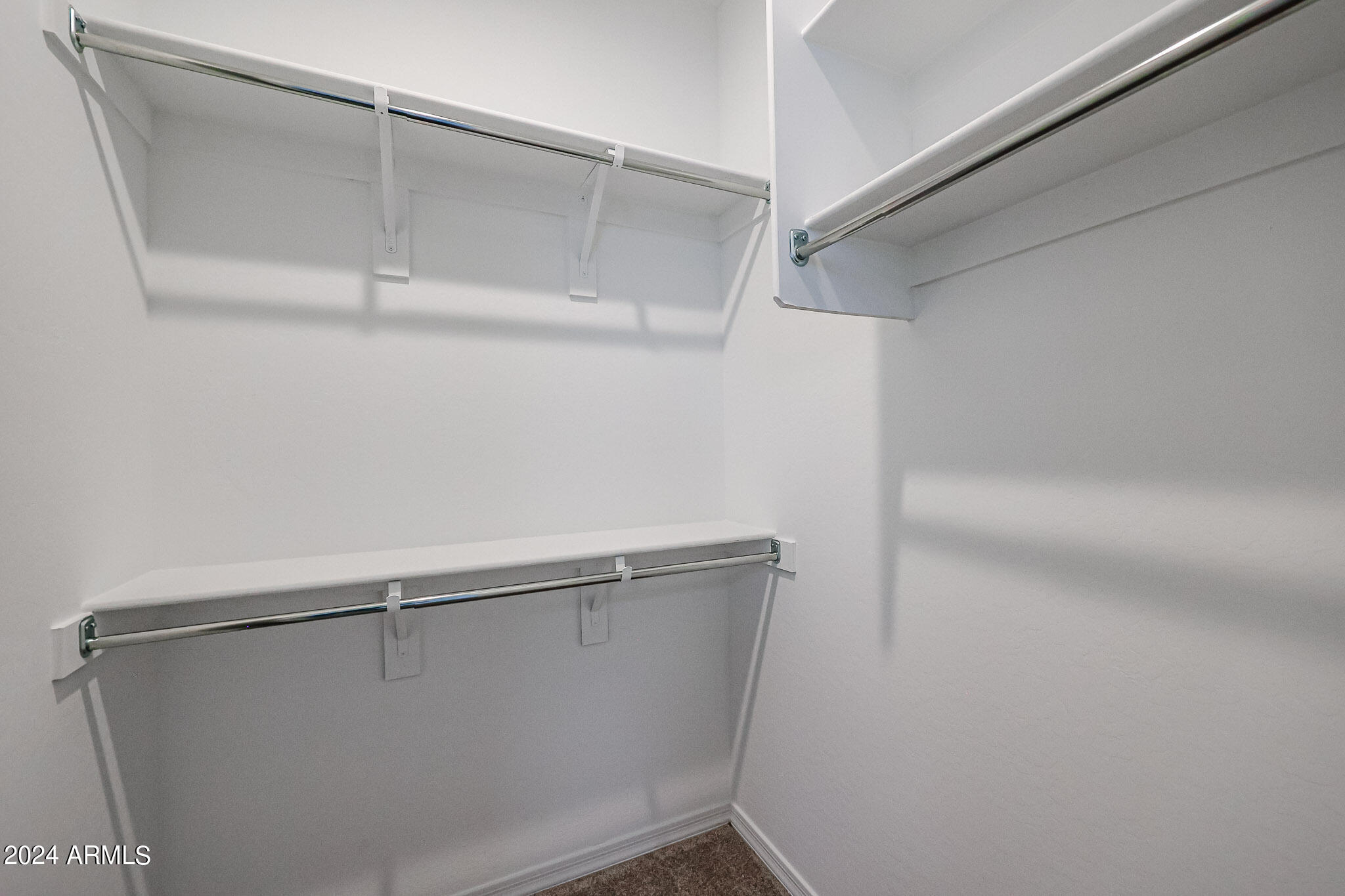 8907 West Colter Street Glendale, AZ 85305 - Photo 25 of 44 a view of a room with racks on the wall