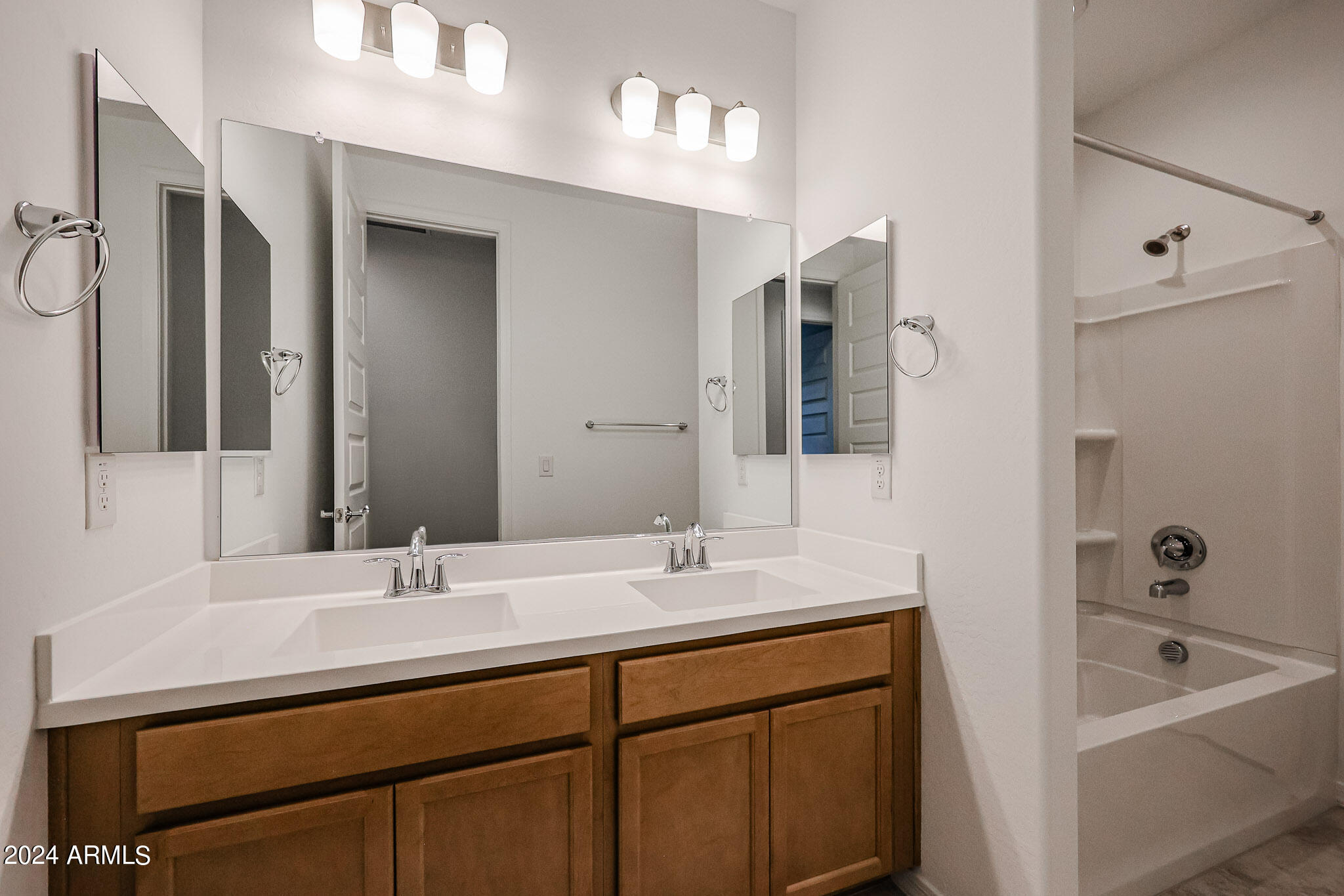 8907 West Colter Street Glendale, AZ 85305 - Photo 33 of 44 a bathroom with a sink double vanity and a bathtub