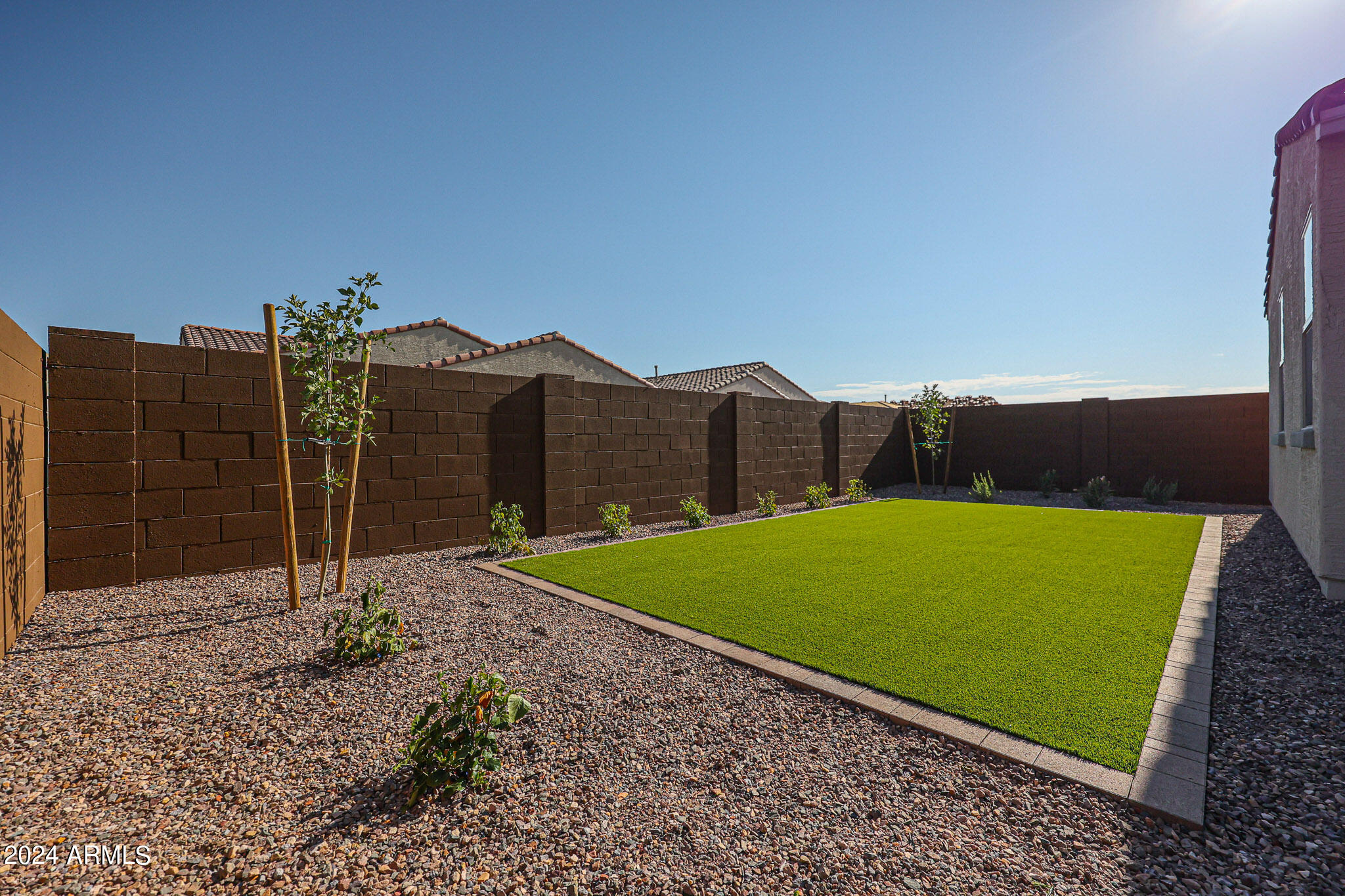 8907 West Colter Street Glendale, AZ 85305 - Photo 35 of 44 a view of a back yard with a small pool