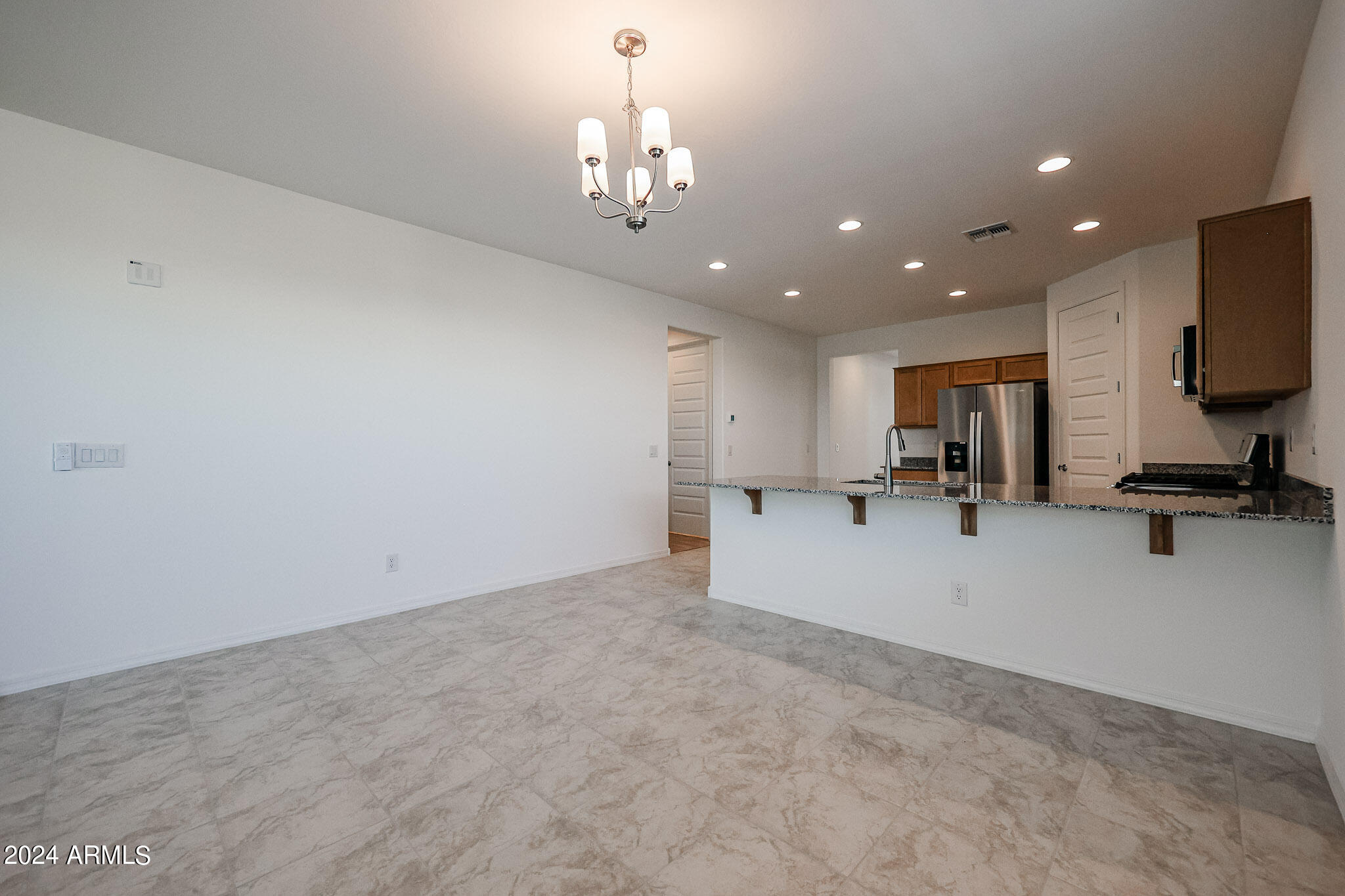 8907 West Colter Street Glendale, AZ 85305 - Photo 6 of 44 a view of kitchen with refrigerator and window