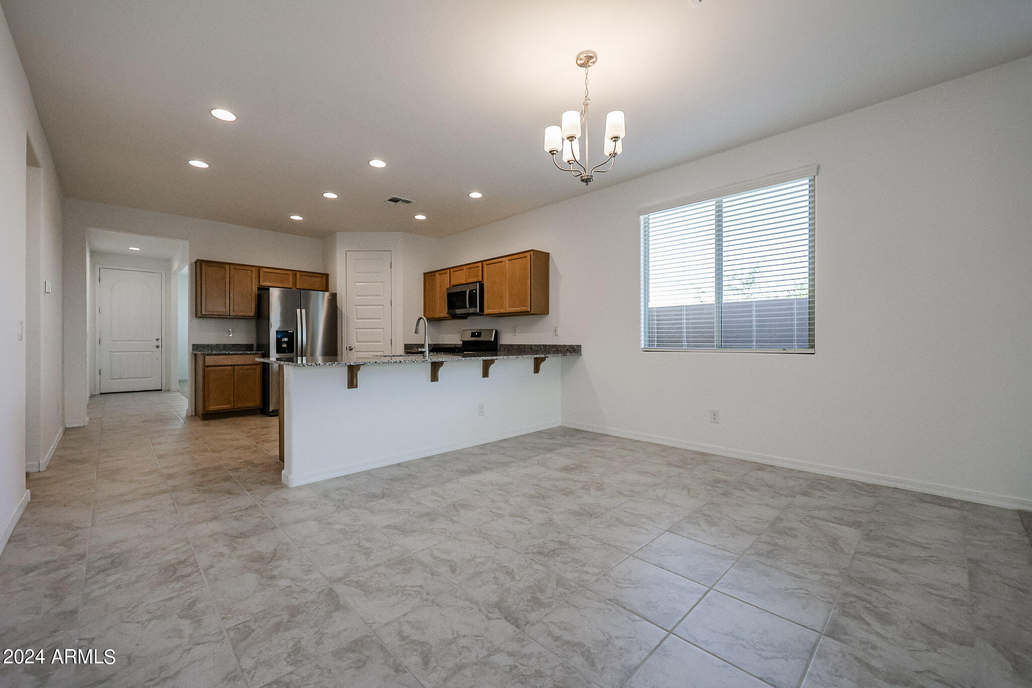 8907 West Colter Street Glendale, AZ 85305 - Photo 43 of 44 a view of a kitchen with a sink cabinets and stainless steel appliances