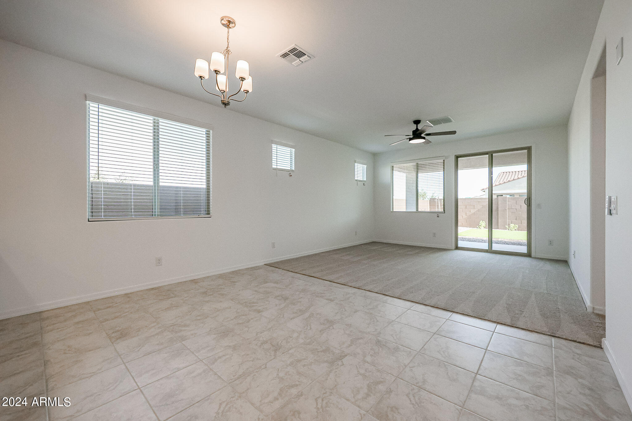 8907 West Colter Street Glendale, AZ 85305 - Photo 8 of 44 a view of an empty room with a window