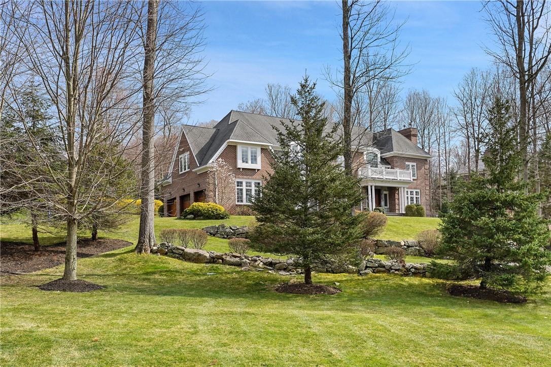 a view of a building with trees in front of it