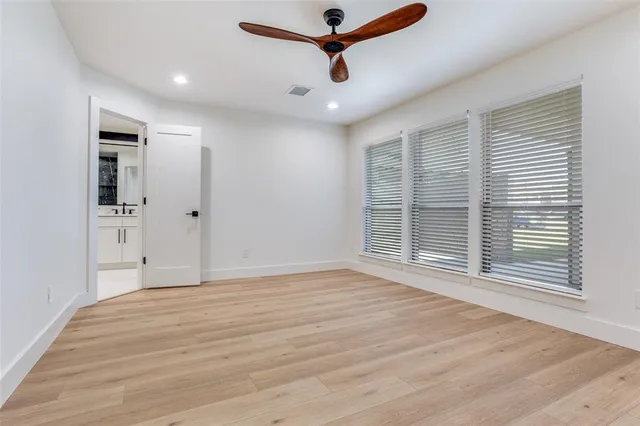 a bathroom with double sink and a mirror