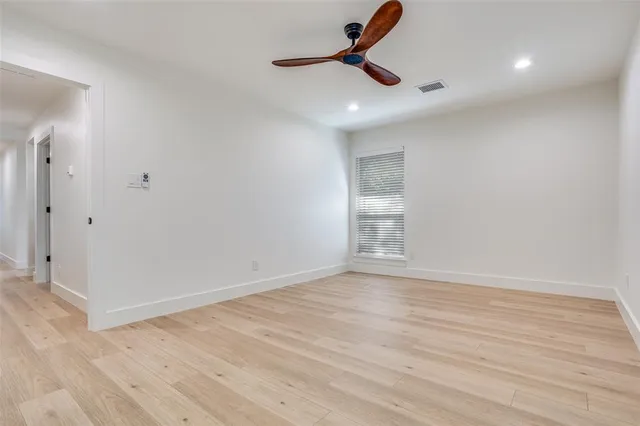 a bathroom with a double vanity sink toilet mirror and bathtub