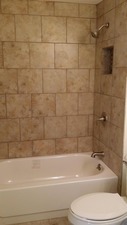 254 Seabury Road Bolingbrook, IL 60440 - Photo 8 of 12 a bathroom with a toilet and a bath tub