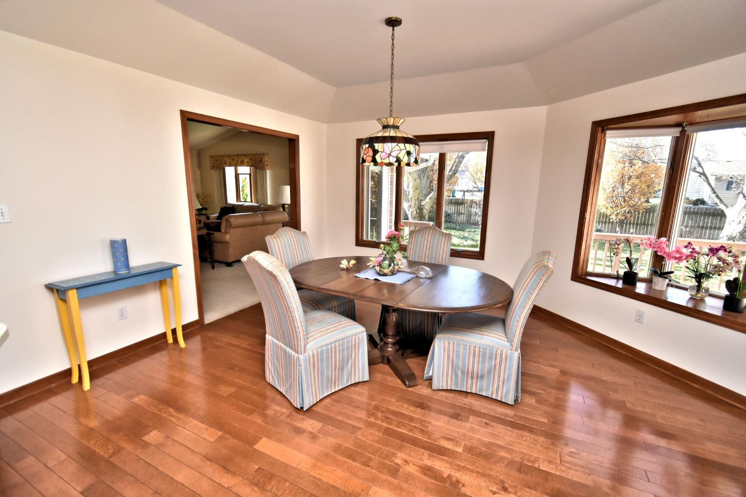 8408 Castle Drive Munster, IN 46321 - Photo 15 of 28 a view of a dining room with furniture window and wooden floor