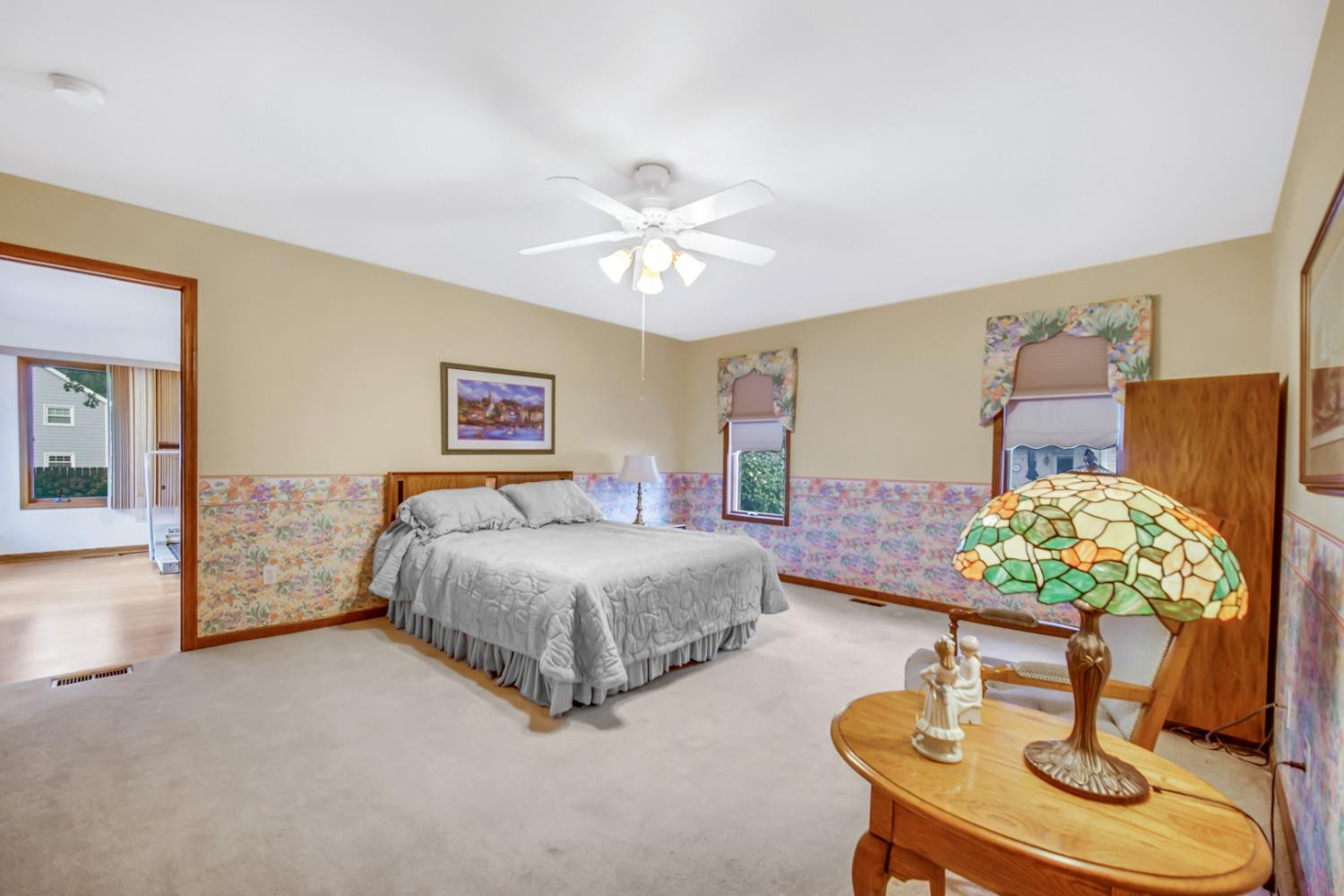 8408 Castle Drive Munster, IN 46321 - Photo 17 of 28 a living room with furniture and a chandelier