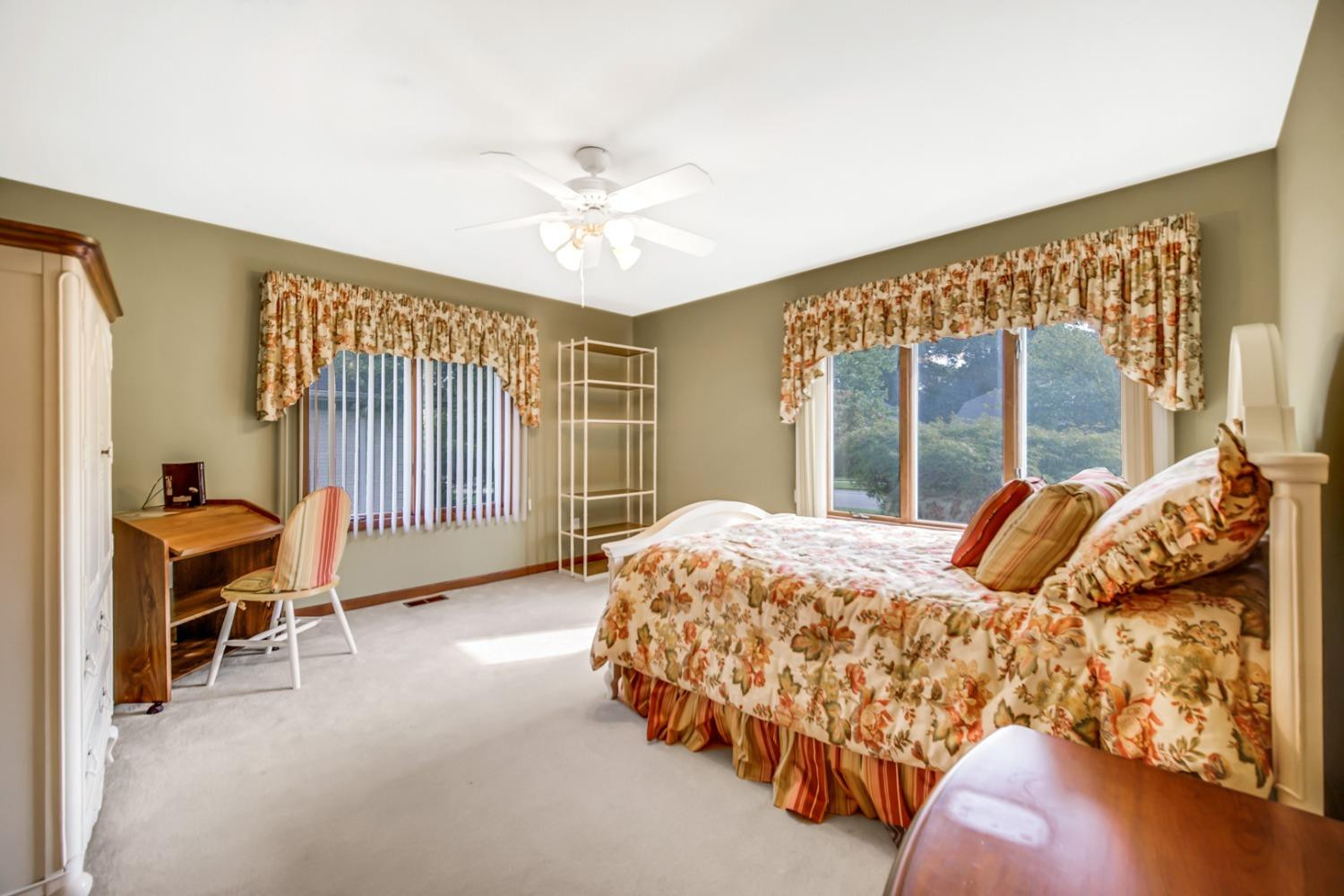 8408 Castle Drive Munster, IN 46321 - Photo 19 of 28 a bedroom with a bed and a large window
