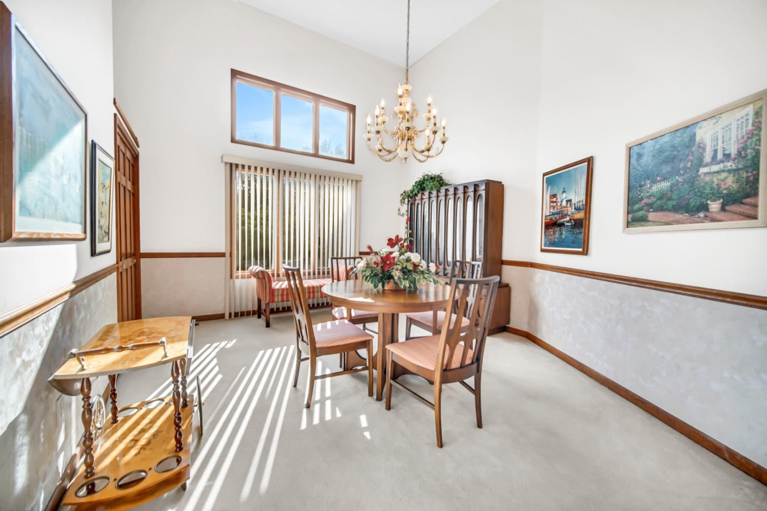 8408 Castle Drive Munster, IN 46321 - Photo 6 of 28 a view of a dining room with furniture a chandelier and wooden floor