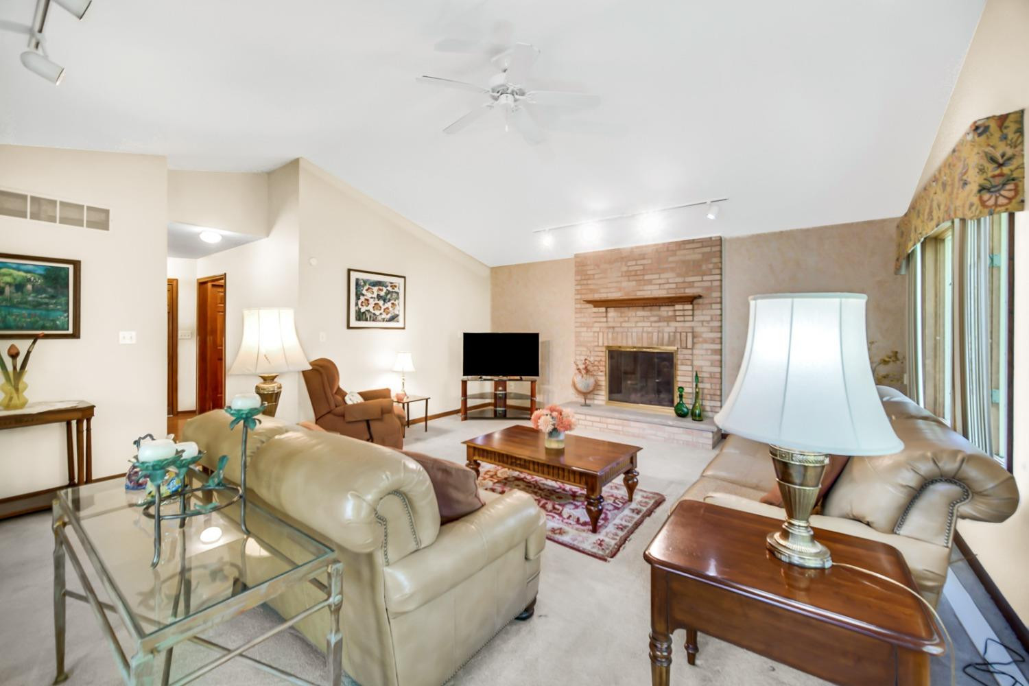 8408 Castle Drive Munster, IN 46321 - Photo 7 of 28 a living room with furniture and a lamp
