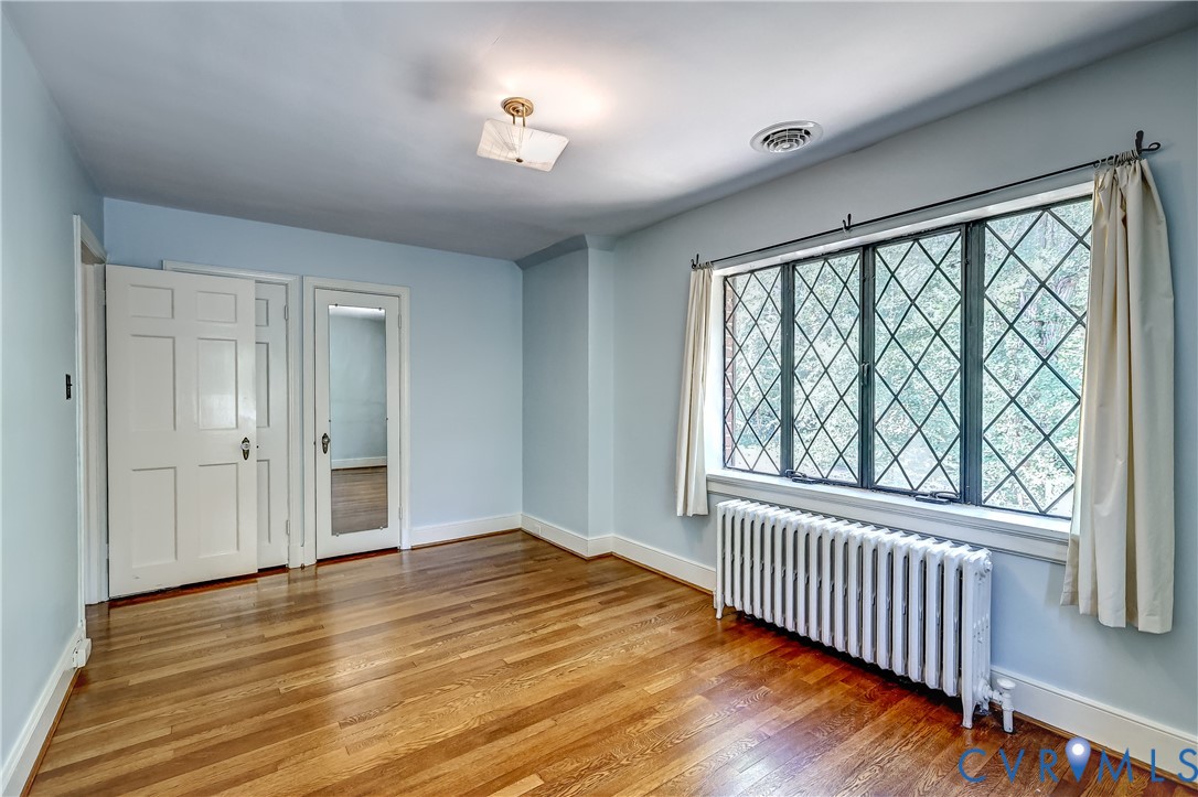 4814 Riverside Drive Richmond, VA 23225 - Photo 26 of 39 a view of empty room with wooden floor and fan
