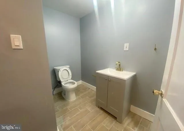 a bathroom with a toilet and a sink