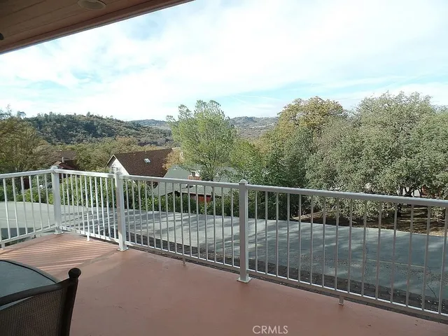 a dining room with furniture and a chandelier