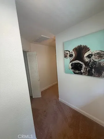 a bedroom with a bed and a ceiling fan