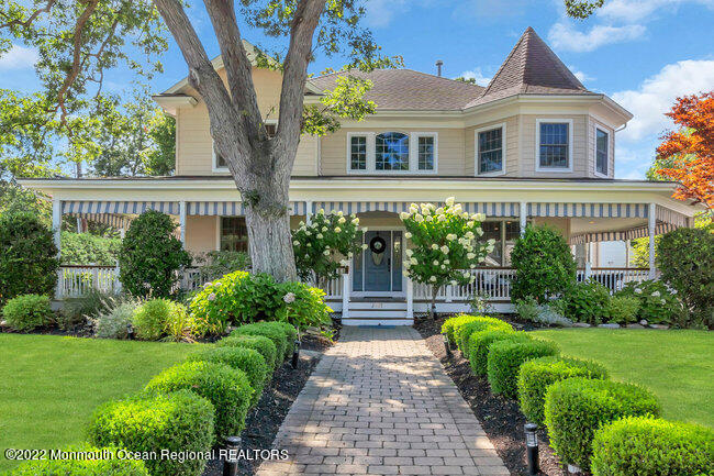 2107 3rd Avenue Spring Lake, NJ 07762 - Photo 1 of 40 a front view of a house with a yard