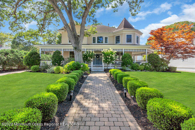 2107 3rd Avenue Spring Lake, NJ 07762 - Photo 2 of 40 a front view of a house with a yard
