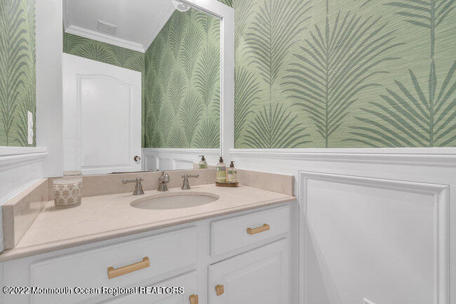 2107 3rd Avenue Spring Lake, NJ 07762 - Photo 21 of 40 a bathroom with a sink and a mirror