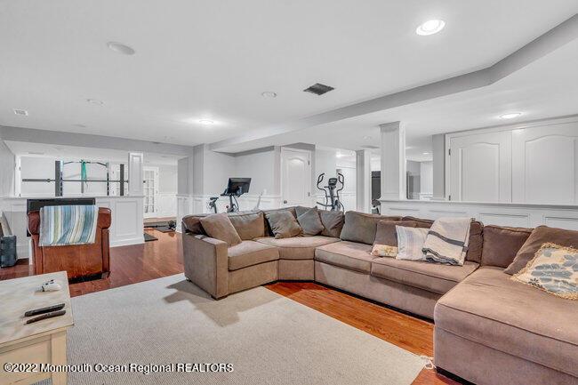 2107 3rd Avenue Spring Lake, NJ 07762 - Photo 28 of 40 a living room with furniture and a wooden floor